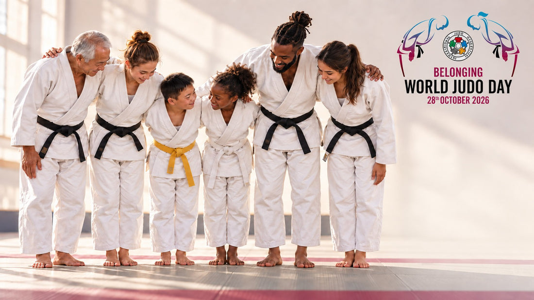 Six people in white judogi stand arm in arm on a tatami, with two children in the centre wearing white and yellow belts.